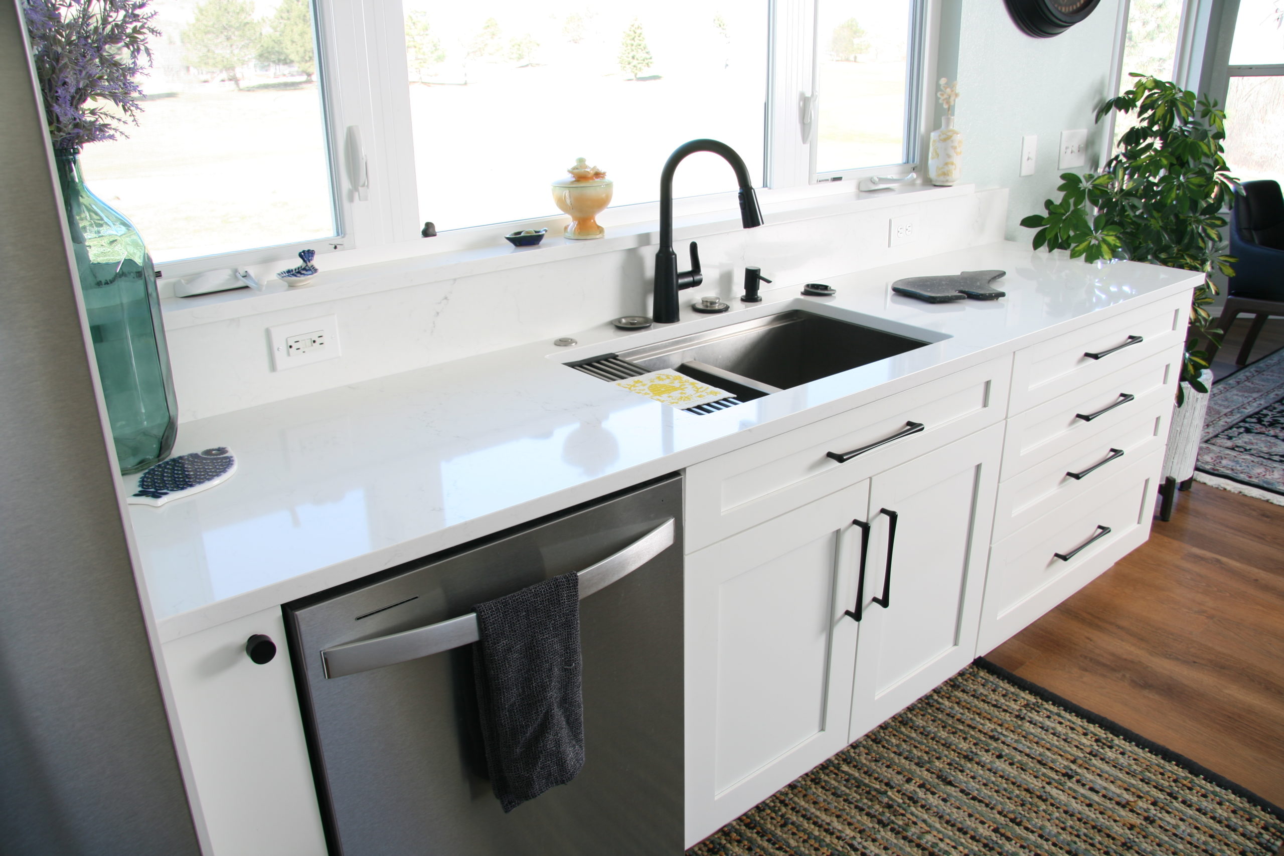Longmont white clean countertops and cabinet designs
