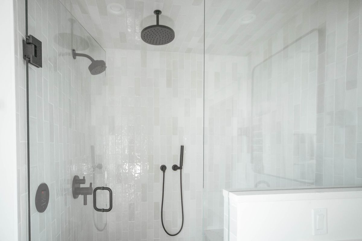 New white and gray shower tile remodel