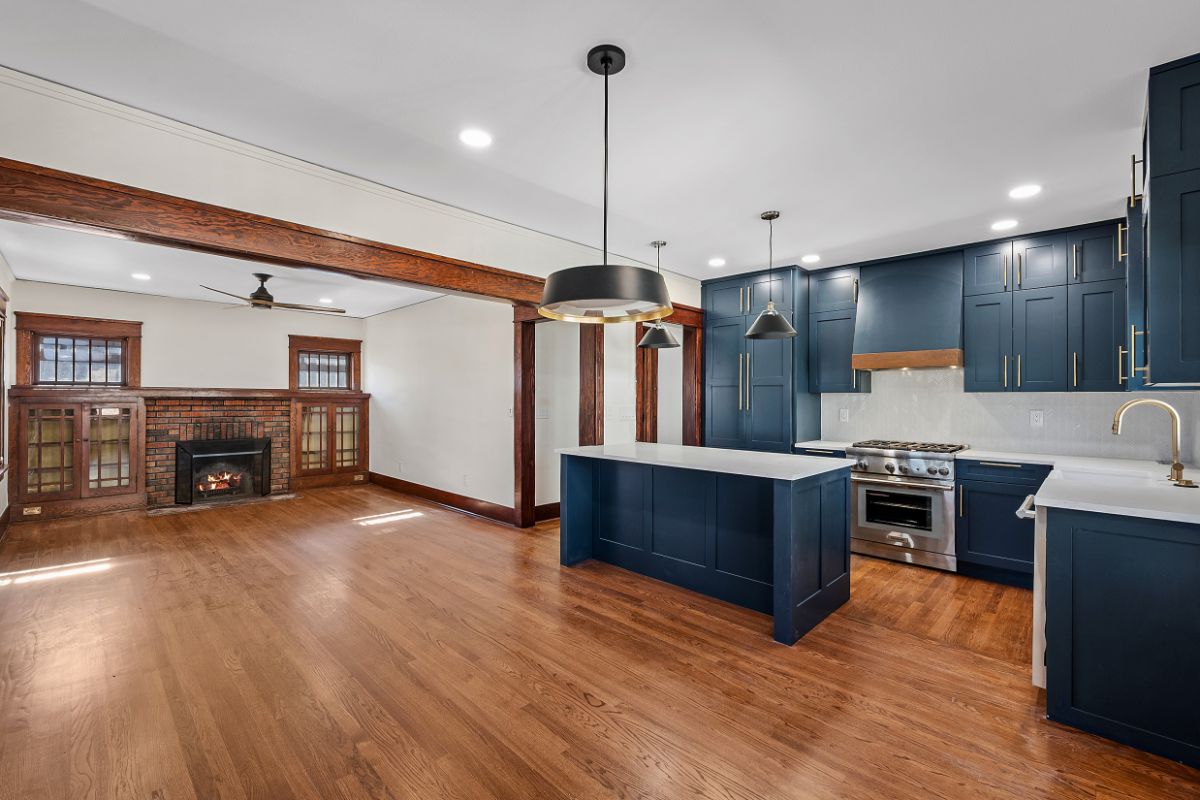 Custom home and kitchen wood redesign with blue cabinets