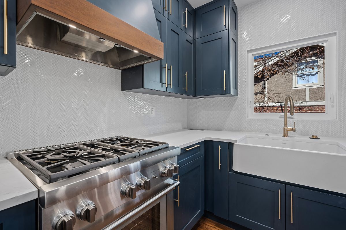 Longmont custom blue cabinets and white countertops